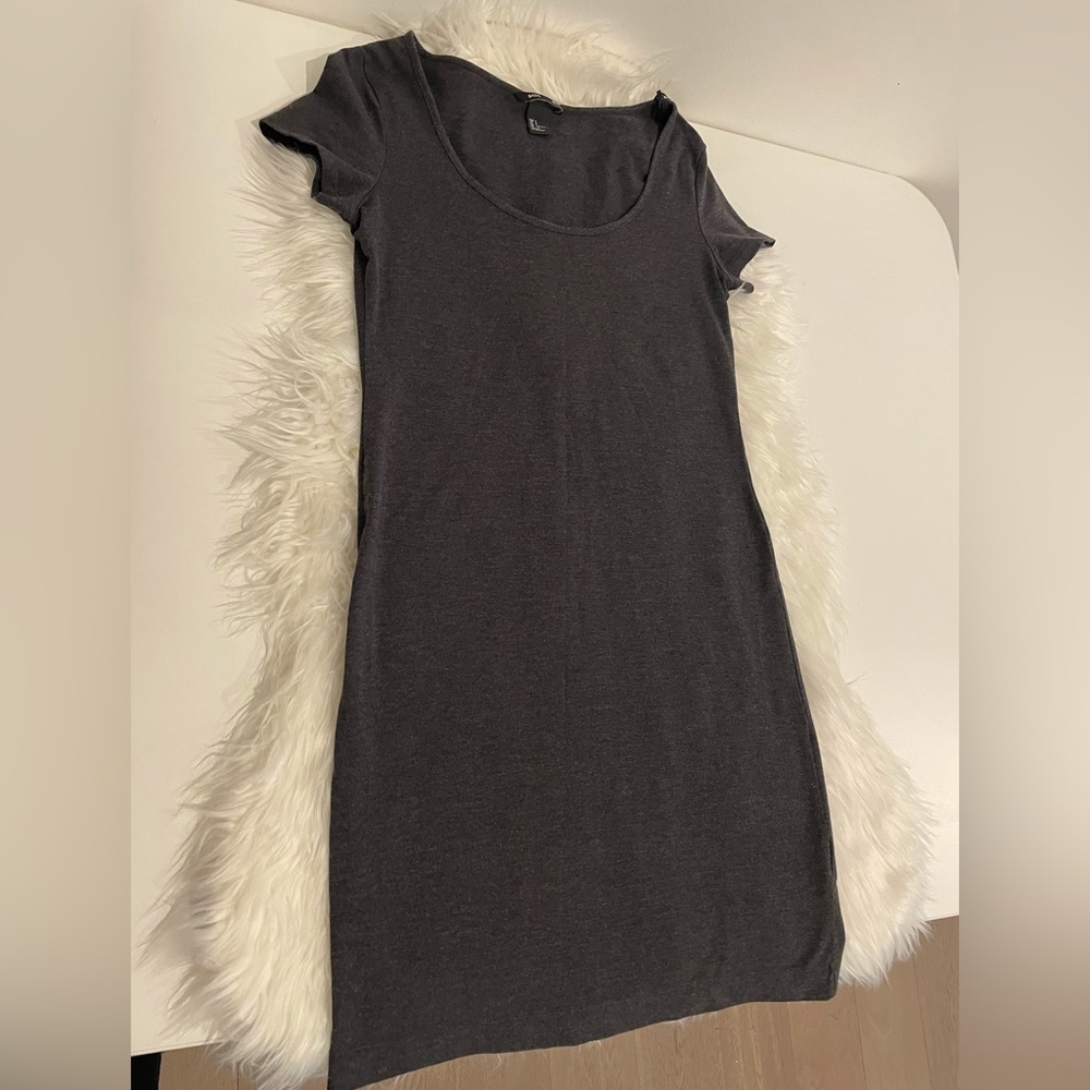 Stretchy form fitting, short sleeve mini dress.